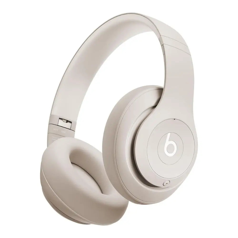 Beige Beats headphones on a white background